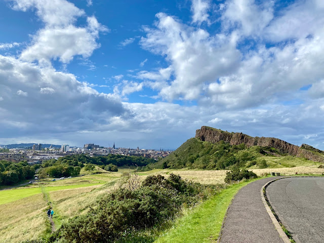 Salisbury Crags and city skyline viewed from Queen's Drive, Holyrood Park, Edinburgh, Scotland