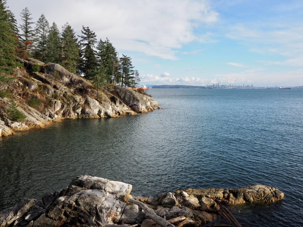 Photo of Starboat Cove and Vancouver skyline in Lighthouse Park.