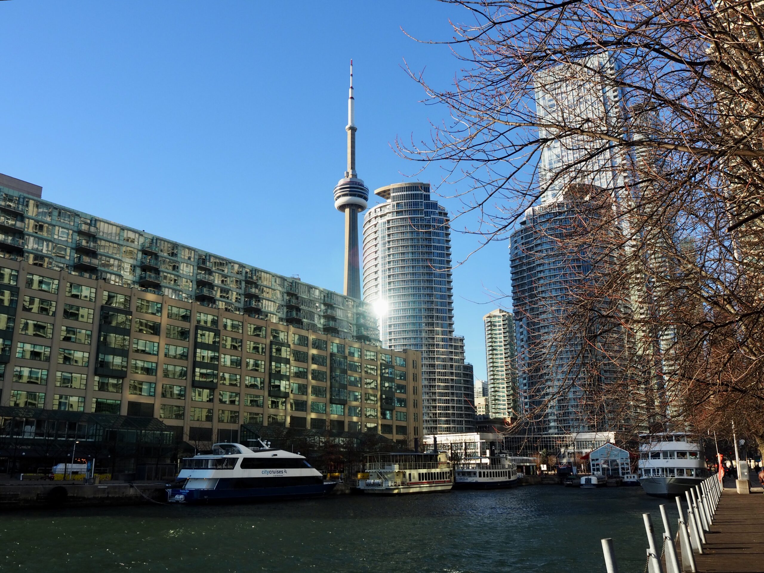 Weekend Trip to Toronto cover photo featuring the CN Tower by the harbour front