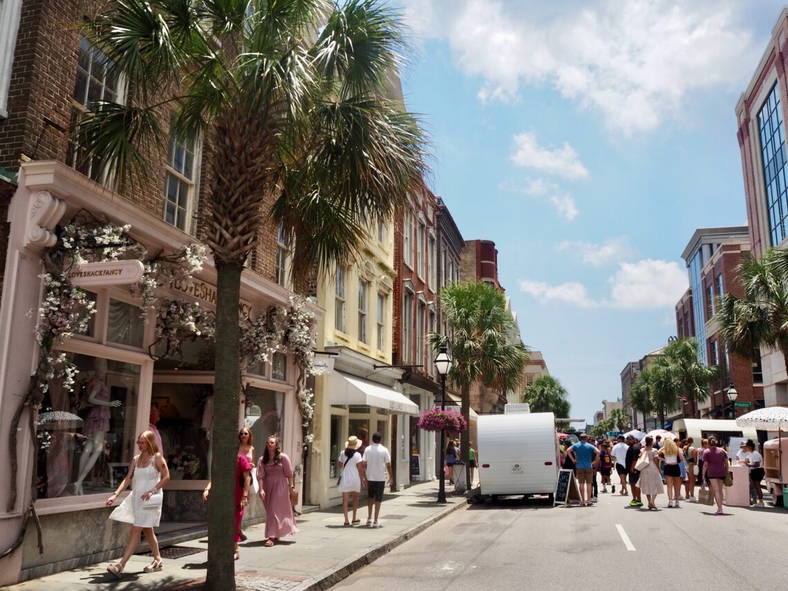 Highlights of Charleston, SC - feature photo - colourful buildings, food trucks and palm trees in the sun on King Street