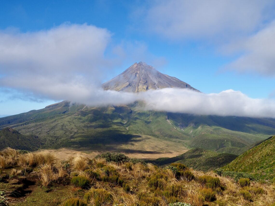 3 Days in Taranaki - feature photo - Mount Taranaki volcano view from Pouakai Tarn hike with cloud across the centre