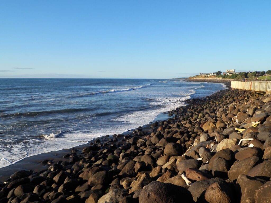 3 days in Taranaki - second feature photo - New Plymouth Coastal Walkway, ocean view with black volcanic rocks at golden hour