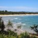 Sydney to Byron Bay - feature photo - surfers at The Pass in Byron Bay, NSW, Australia