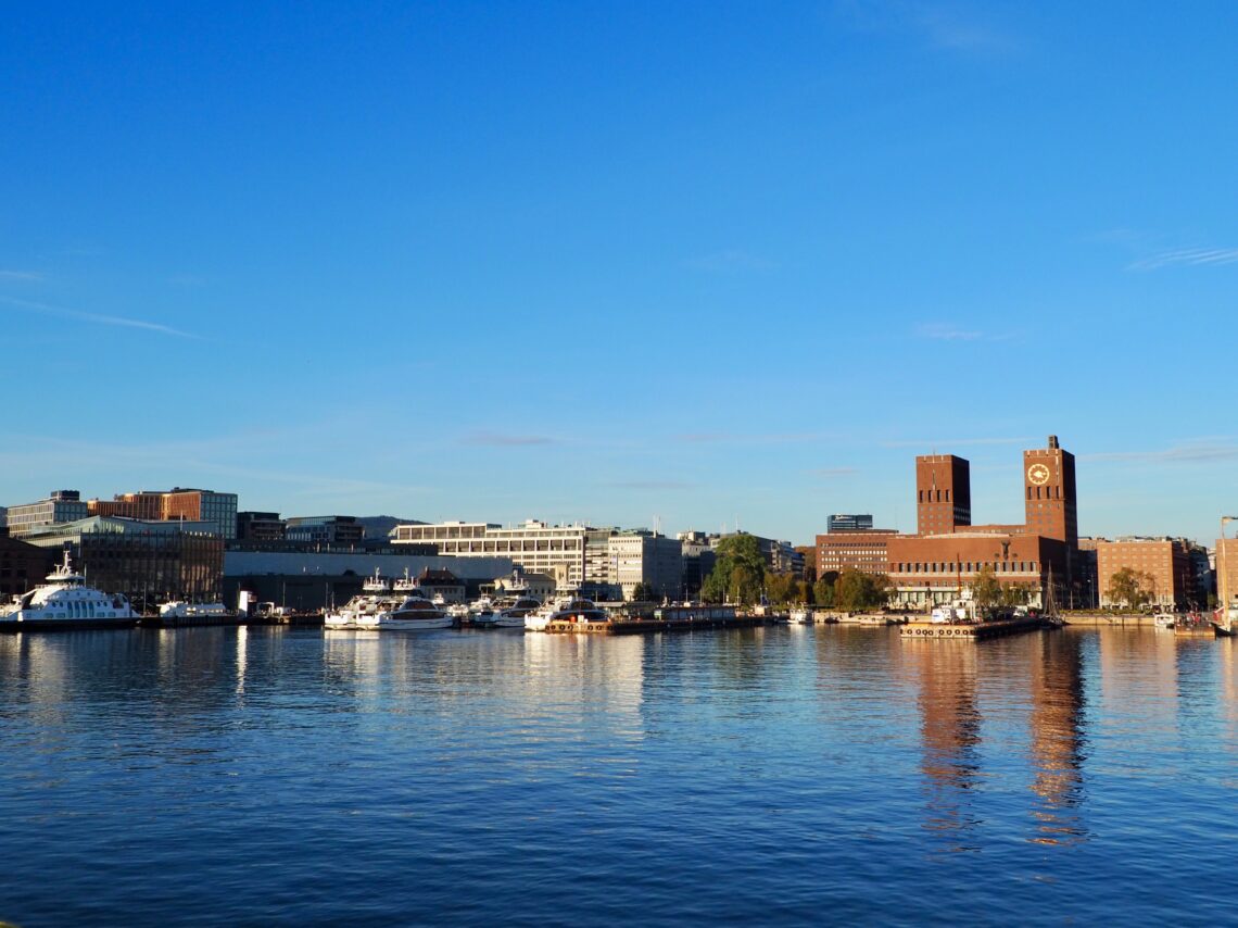 A Weekend in Oslo - feature photo - Oslo harbour waterfront featuring ferries and the Rådhus city hall, Norway